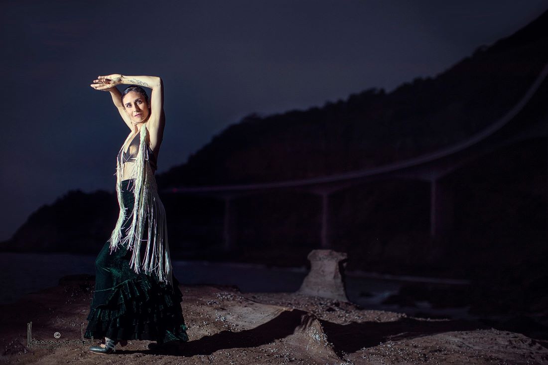 woman dancing by the ocean