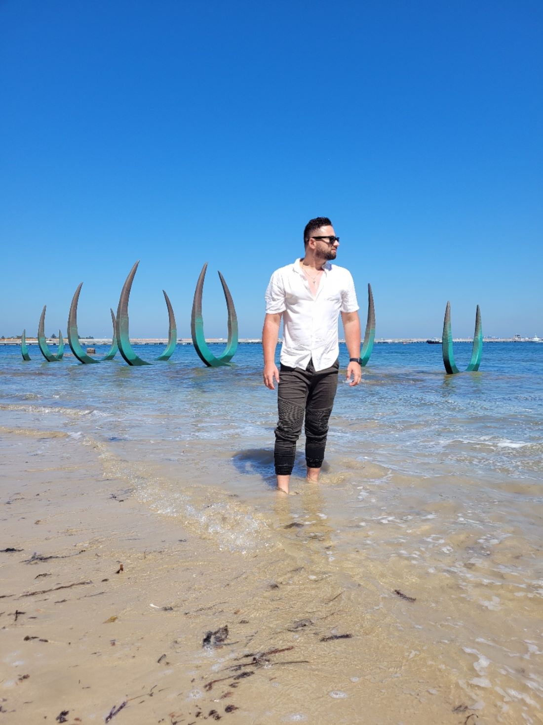 Man standing in the ocean